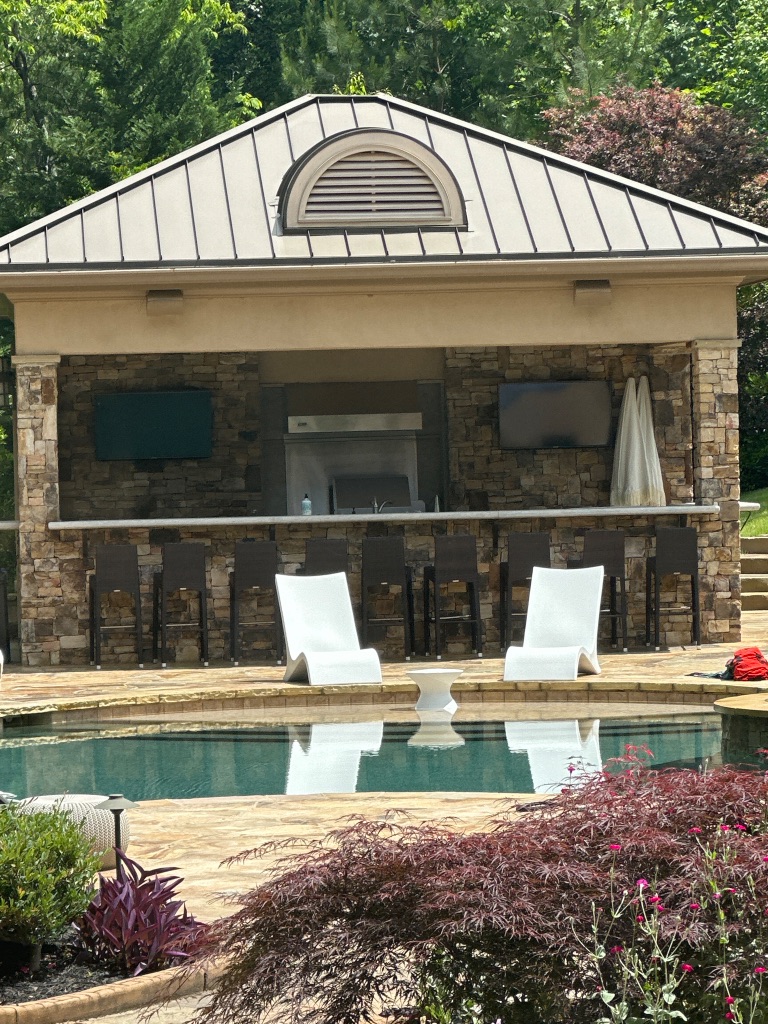 DLSAV poolside outdoor AV installation — cabana with dual TVs
